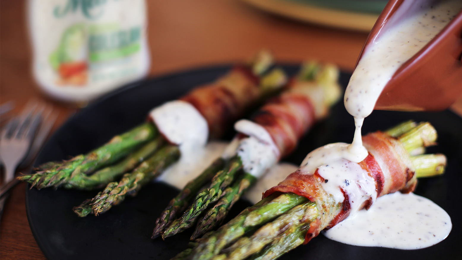 Asparagus with Bacon and Lemon Pepper Drizzle is made with Marie’s Original Coleslaw Dressing.