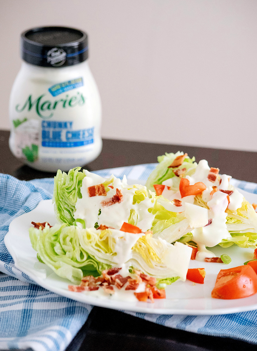 Iceberg Wedge Salad is made with Marie’s Chunky Blue Cheese Dressing.