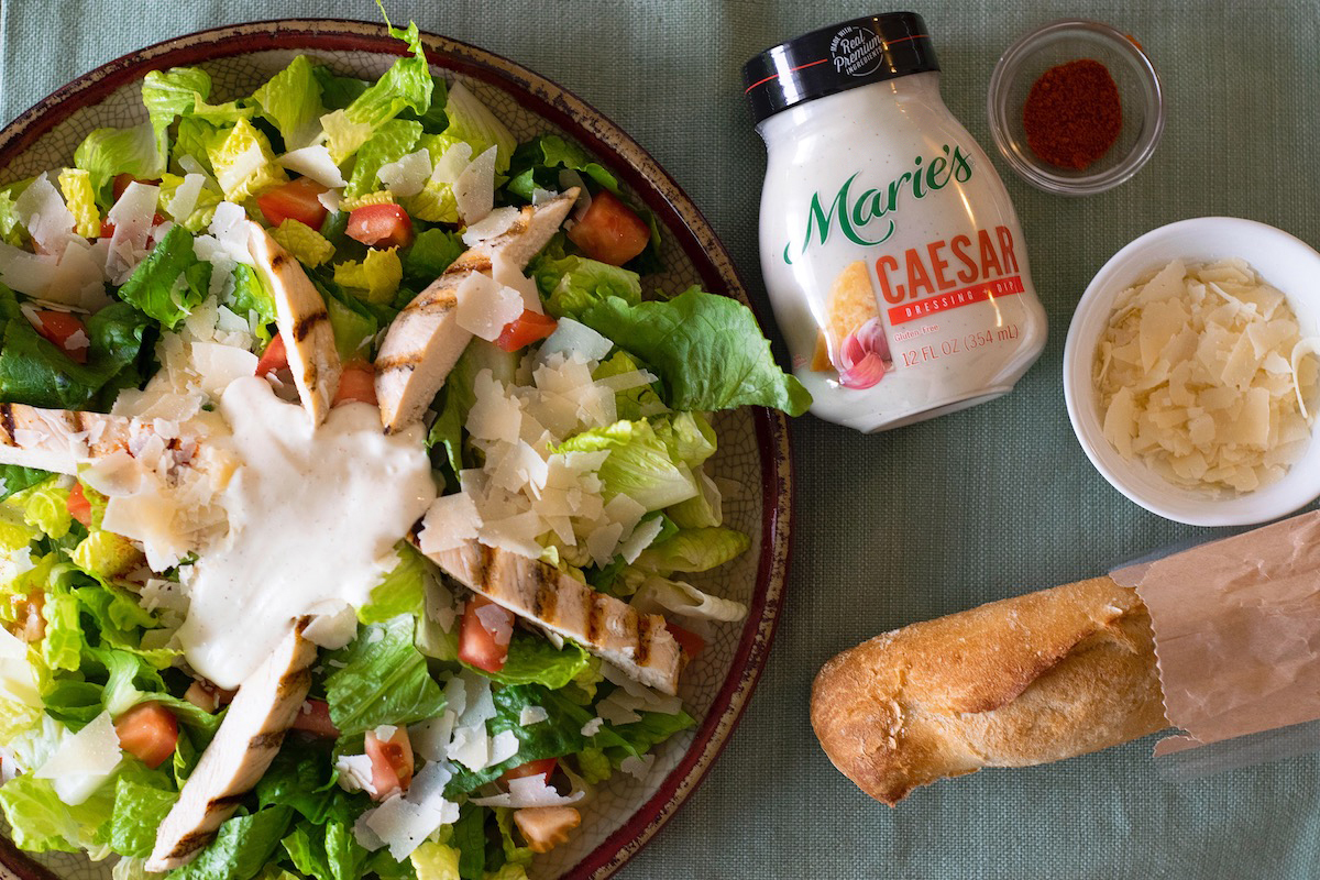 Grilled Chicken Caesar Salad is made with Marie’s Caesar dressing.