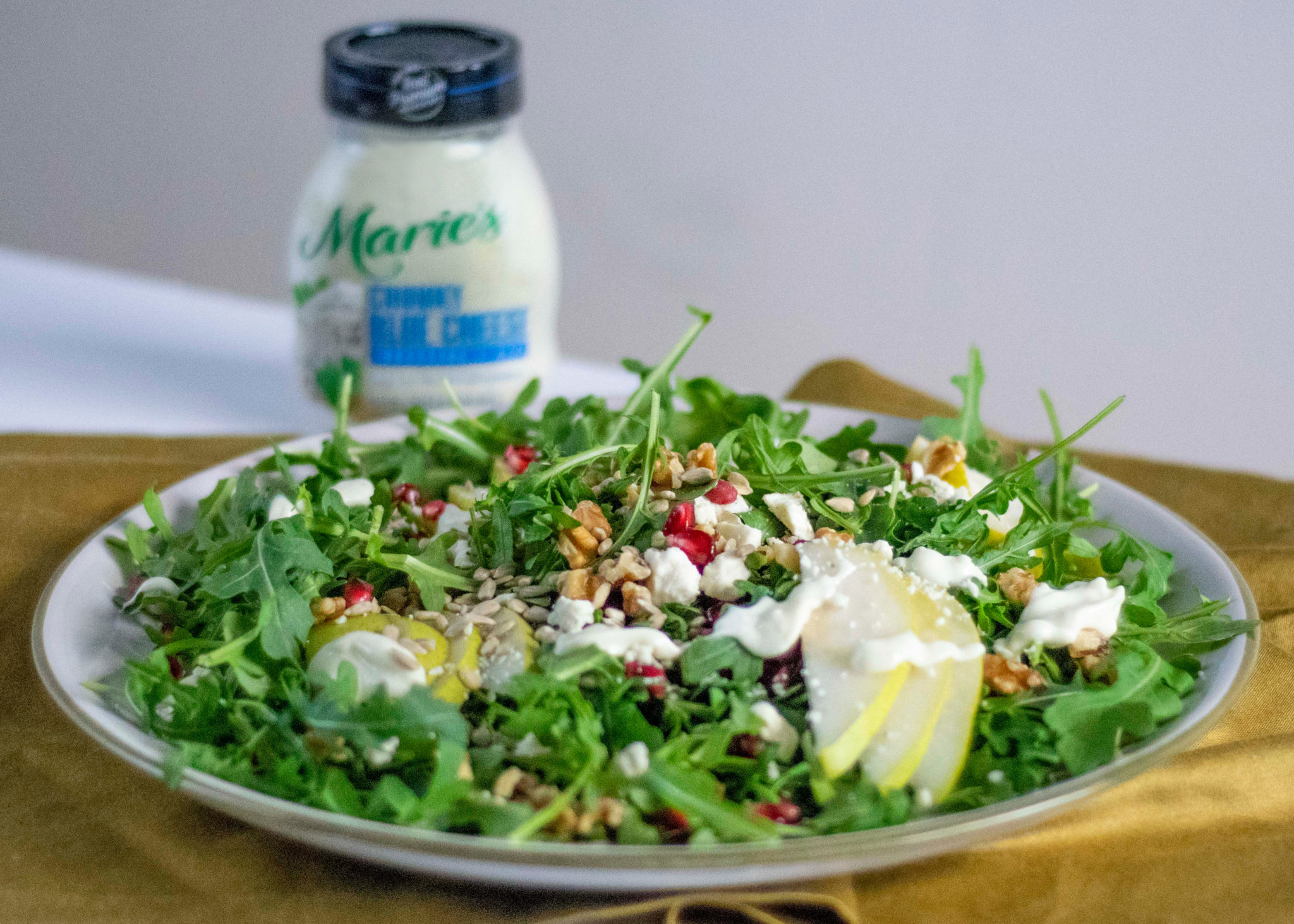 Blue Cheese Arugula Pear Salad is made with Marie’s Chunky Blue Cheese dressing.