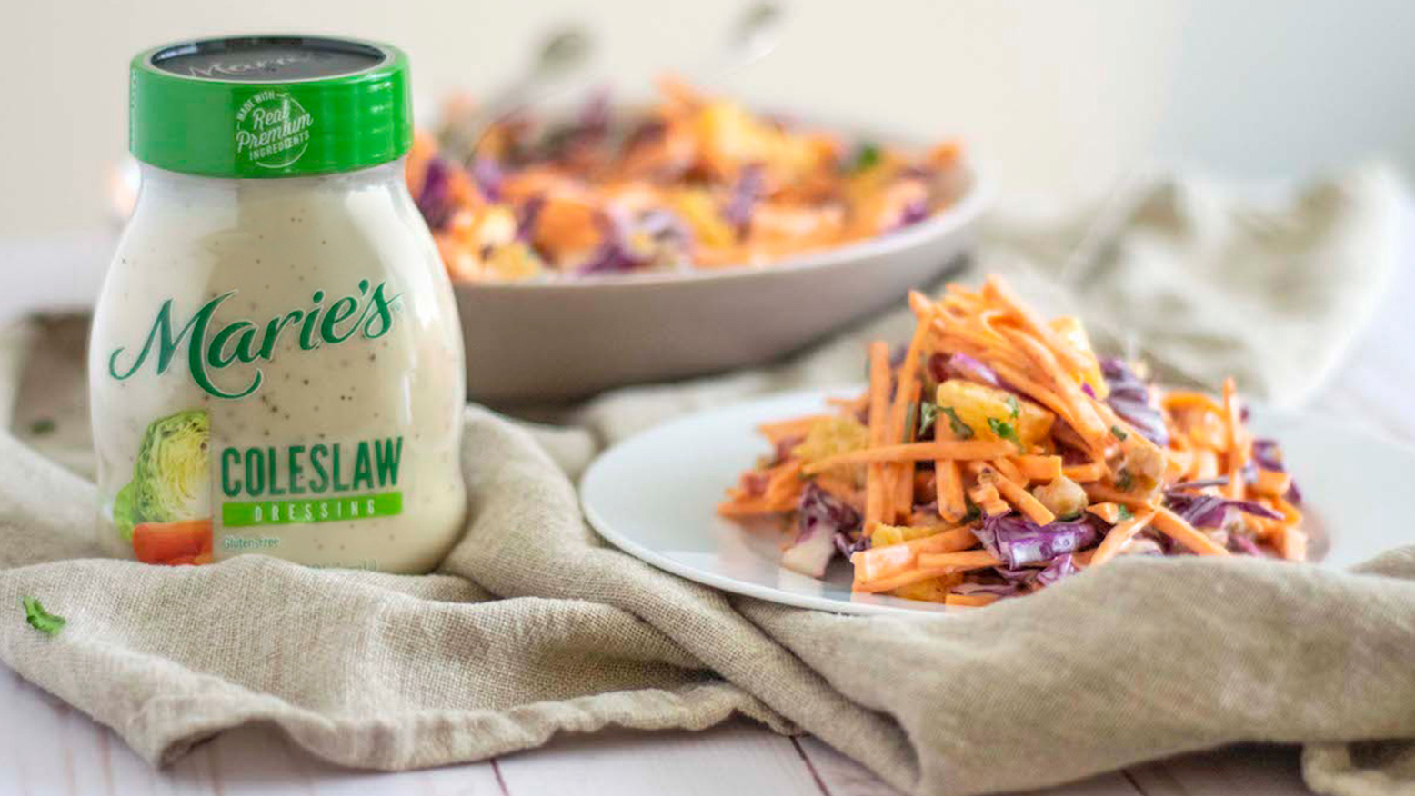 Creamy Sweet Potato Pomegranate Slaw is made with Marie’s Original Coleslaw dressing.
